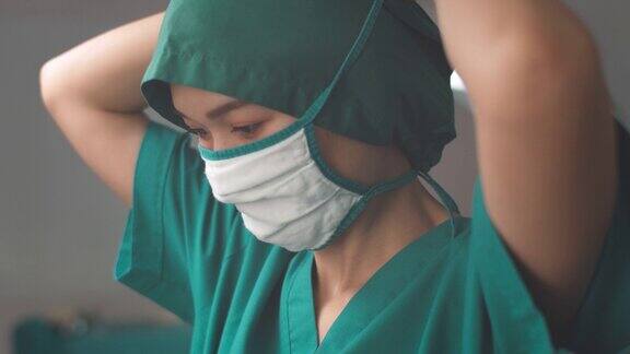 亚洲女外科医生在手术中戴上医用口罩外科医生准备手术