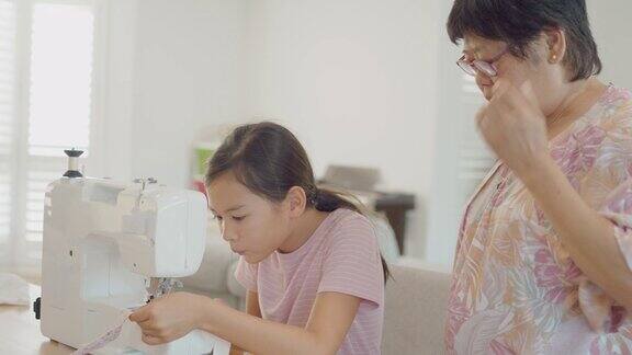 亚洲祖母在家教孙女如何缝纫