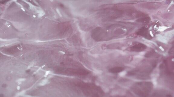 微距幻灯片拍摄化妆品抽象粉色凝胶表面气泡