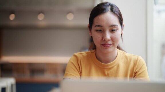 亚洲女性使用笔记本电脑