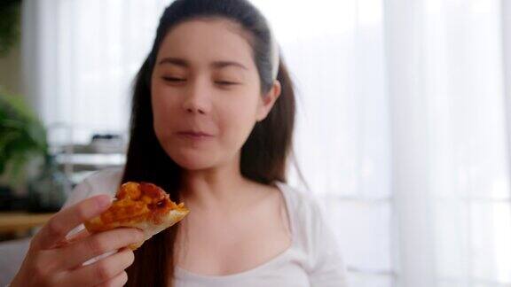 孕妇在家吃不健康的披萨