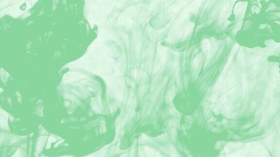 摘要微距慢镜头拍摄在黑色上孤立的绿色软颗粒流体油漆滴在水里混合墨水和烟雾在水下翻滚彩色云抽象烟雾爆炸动画3D渲染素材视频