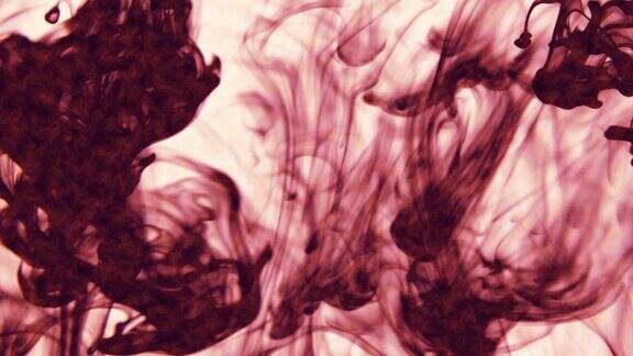 摘要:微距慢动作拍摄粉红色和黑色粒子流体隔离在黑色上油漆滴在水里混合墨水和烟雾在水下翻滚彩色云抽象烟雾爆炸动画3D渲染素材视频