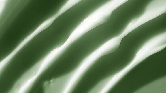 微距拍摄的白色绿色奶油与移动光源