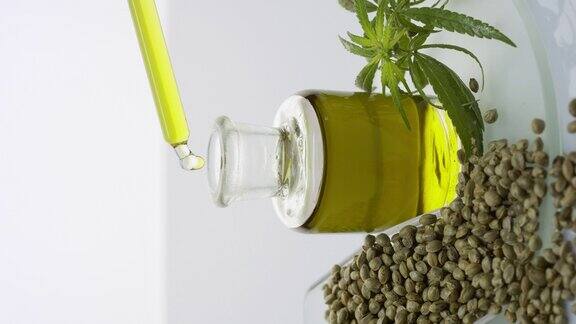 移液管滴油瓶上的玻璃与种子勺和枝条