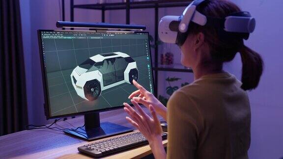 女设计师用电脑和虚拟现实在家里设计她的3d作品