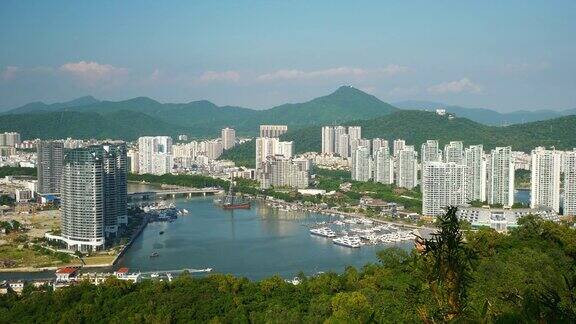 阳光明媚的一天山顶三亚城市河滨全景4k海南中国