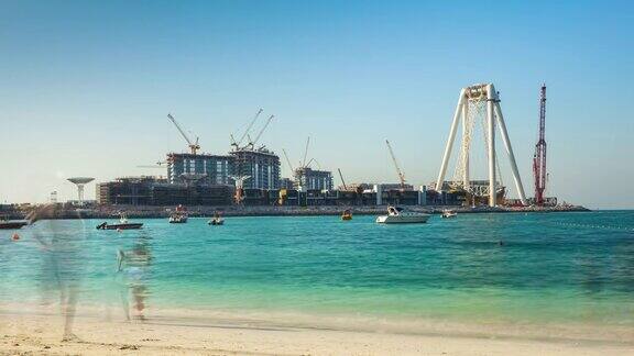 阿拉伯联合酋长国晴天迪拜码头海滩眼轮建筑酒店全景4k时间流逝