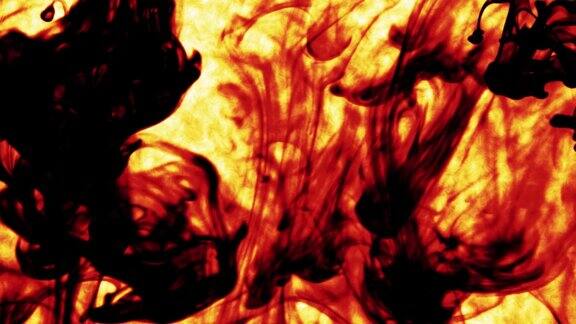 摘要微距慢动作拍摄的黄橙黑火焰图案颗粒流体孤立在黑色上油漆滴在水里混合墨水和烟雾在水下翻滚彩色云抽象烟雾爆炸动画3D渲染素材视频