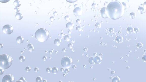 微距拍摄的各种液体气泡在水中上升的光背景
