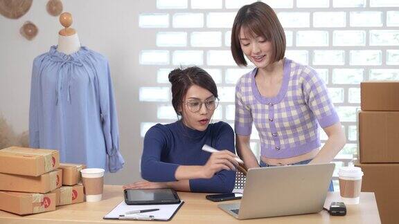 亚洲女性和合伙人在家工作在线业务所有者小型企业中小企业