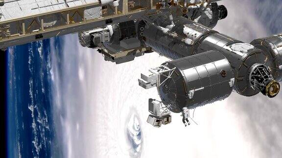 国际空间站围绕地球大气层旋转飓风在后面