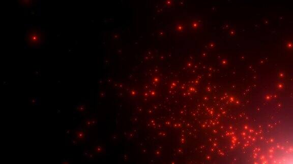 在黑暗的背景上飞行红色的小粒子和星星