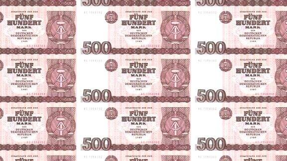 500德国马克或旧德意志共和国银行的德国马克钞票在屏幕上滚动世界硬币现金货币循环