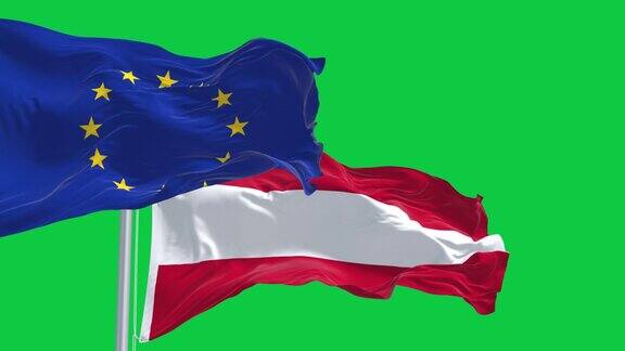 奥地利和欧盟的旗帜在绿色的背景上单独飘扬