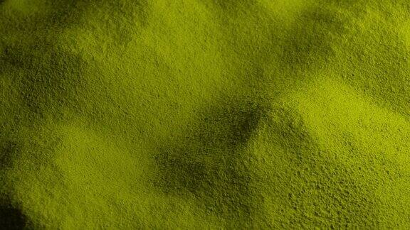 黄绿色粉末材料缓慢旋转