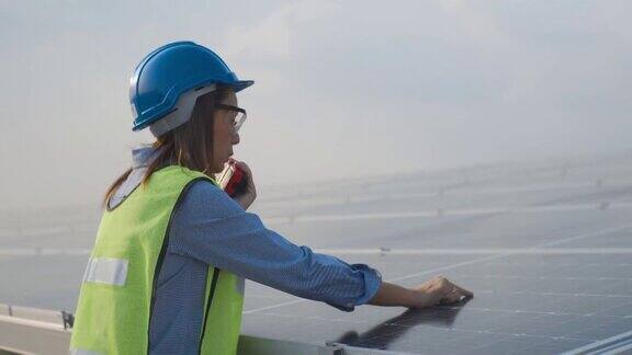 在太阳能电池板厂工作的亚洲女工程师