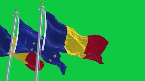 罗马尼亚和欧盟的旗帜在绿色的背景上单独飘扬