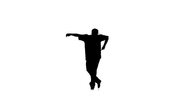 运动男子跳街舞在白色背景慢动作剪影