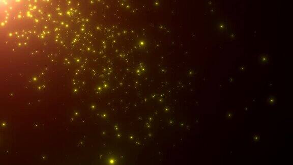 小的金色颗粒和星星飞在黑暗的背景上