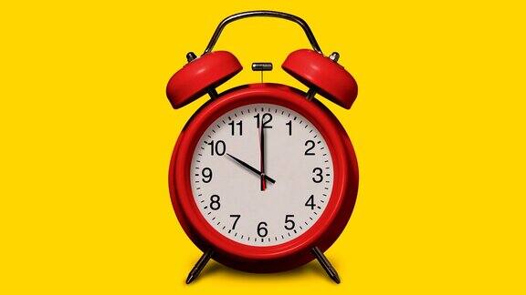 老式的红色闹钟在10点钟在黄色背景上响起