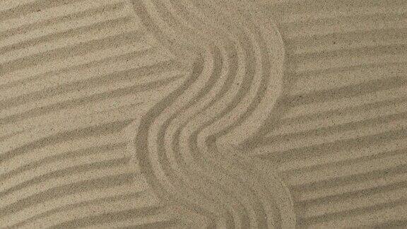 沙子纹理的旋转弯弯曲曲和笔直的沙地沙背景