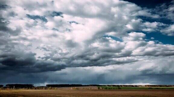 TimeLapseTime-LapseTime-LapseOfRuralFieldSpringMeadowLandscapeUnderScenicDramaticSkyBeforeAndDuringRa