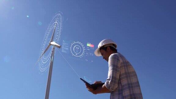工程师在外面工作控制风力涡轮机的能量