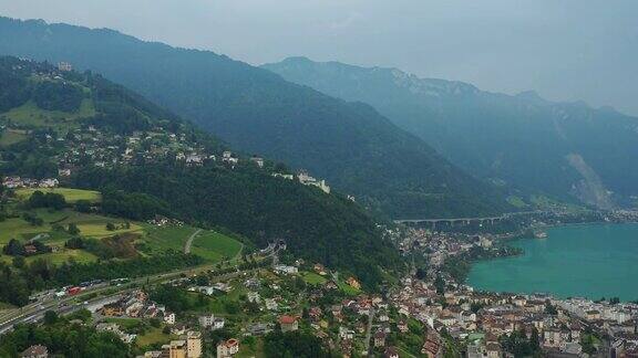 白天飞行蒙特勒市日内瓦湖著名的中央海湾航拍4k瑞士全景图