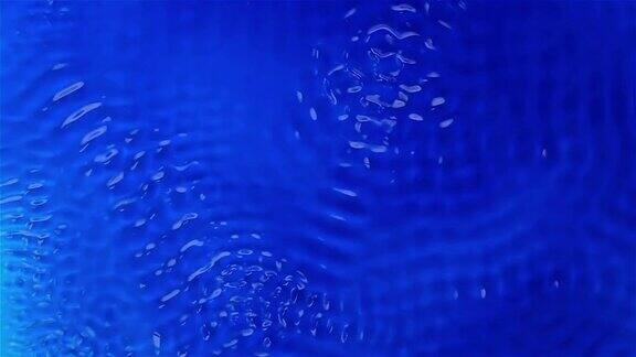 超声波作用下水的物理实验蓝色背景慢动作