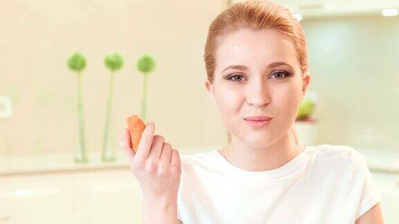 年轻女子在吃胡萝卜有机食品