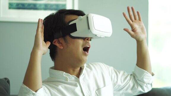 亚洲人戴着虚拟现实头盔