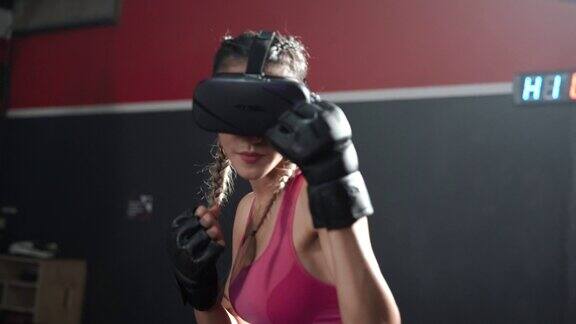 亚洲女性戴着VR头盔和拳击