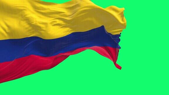 哥伦比亚国旗在绿色背景上孤立地飘扬着
