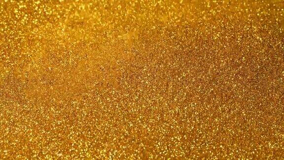 闪亮的金粉洒在黄金表面