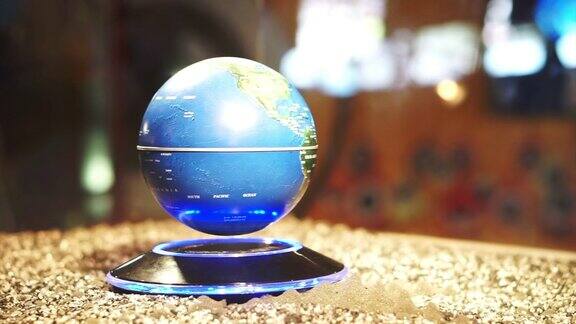 蓝色行星地球背景地球在磁功率模型上旋转