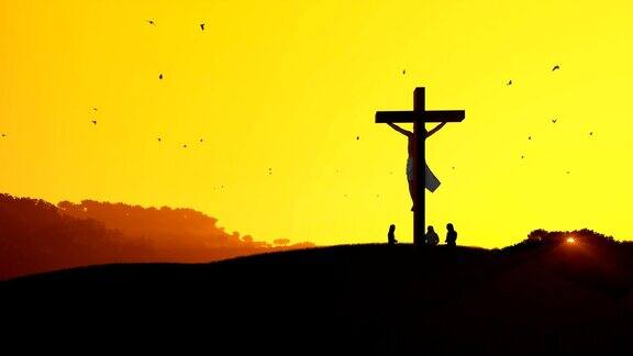 耶稣被钉在十字架上信徒们向炎热的日落祈祷