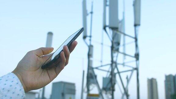 5G通信塔与人使用手机