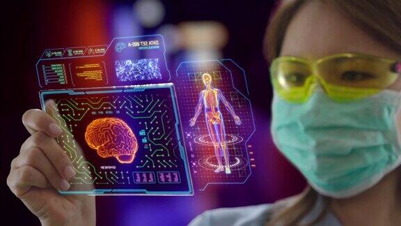 年轻的亚洲女医生使用未来的触屏设备