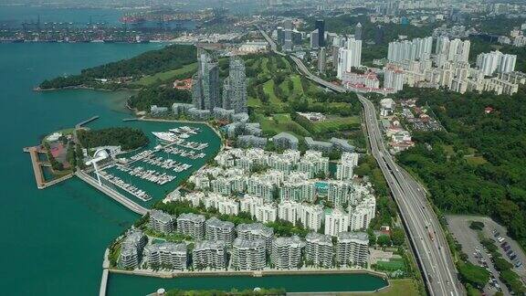 阳光明媚的一天新加坡城市公寓湾复杂游艇码头码头交通道路空中全景4k