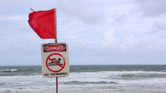 旅游Cinemagraph的一个封闭的海滩标志上的危险的海滩澳大利亚