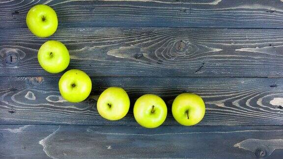 苹果微笑的延时动画停止运动新鲜水果在木桌上4K概念牙科健身健康饮食