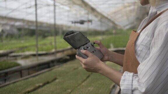 农民使用无人机在农场工作的特写