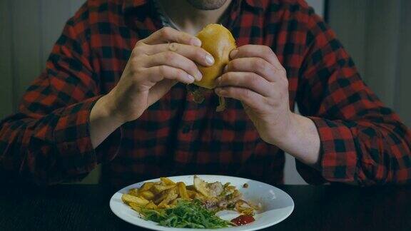 一个年轻人在吃汉堡包120帧秒的慢镜头