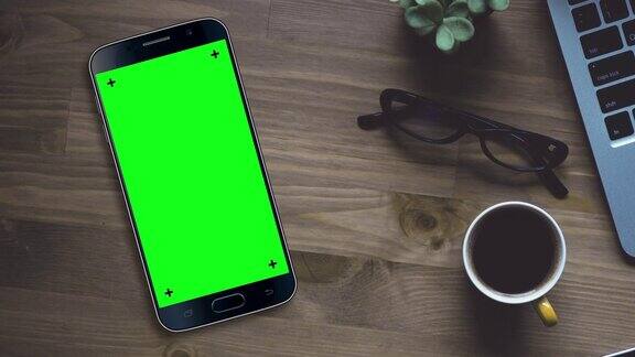 黑色智能手机与色度键绿色屏幕