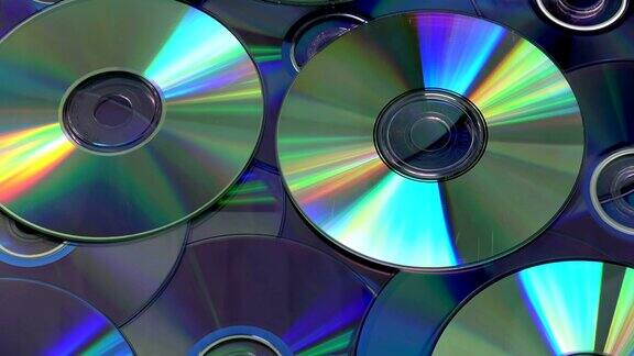 旋转闪亮的DVD和CD光盘背景