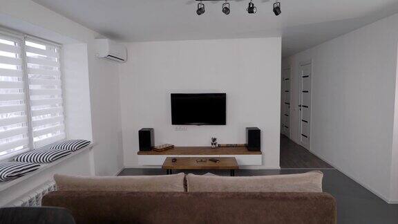 宽敞明亮的客厅在现代公寓斯堪的纳维亚风格的纯粹、极简主义住宅室内设计