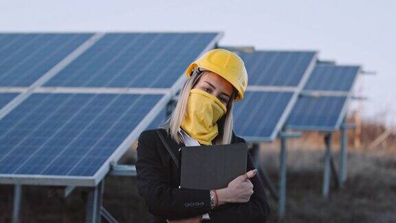 在太阳能发电厂工作的女工程师可再生能源系统太阳能城市