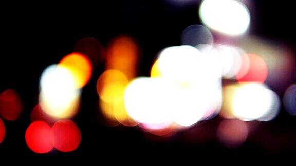 拍摄城市路灯夜景背景散焦车灯