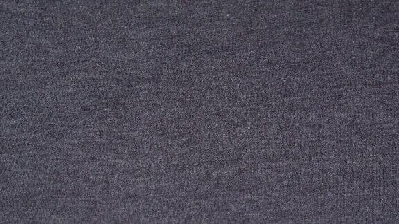 详细的浅灰色纹理织物纺织品材料近距离宏观灰色织物背景浅灰色纤维纺织厂